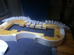 Ribs around mold with linings glued and clamped